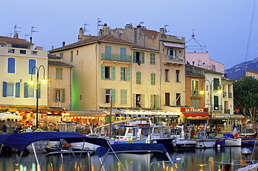 View across the harbour at dusk, Cassis, Bouches-de-Rhone, Provence-Alpes-Cote-d'Azur, France, Europe