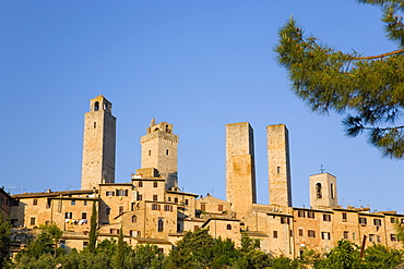 Medieval towers lit by the rising sun, San Gimignano, UNESCO World Heritage Site, Siena, Tuscany, Italy, Europe