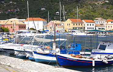 View across the harbour to colourful waterfront buildings, Gaios, Paxos, Paxi, Corfu, Ionian Islands, Greek Islands, Greece, Europe