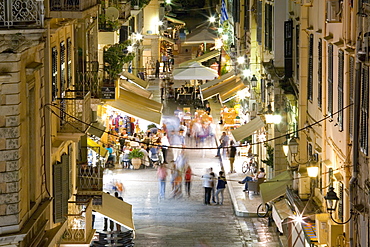 View by night over illuminated Odos Kapodistriou, Corfu Town, Corfu, Ionian Islands, Greek Islands, Greece, Europe