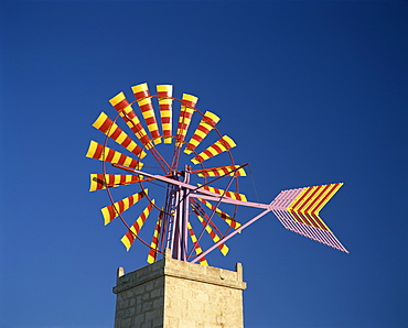 Windmill with sails in the colours of the Mallorcan flag, near Palma, Mallorca, Balearic Islands, Spain, Europe