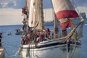 Pirate ship full of pirates, for the start of Pirate's Week, George Town, Grand Cayman, Cayman Islands, Caribbean, Central America