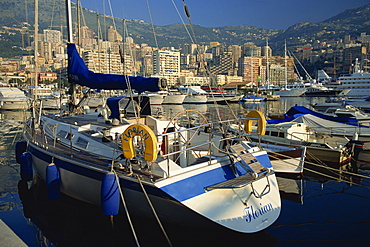 Yacht in foreground, the harbour, Monaco. Cote d'Azur, Mediterranean, Europe