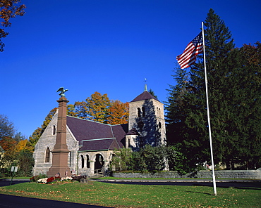 American flag flies outside St. Pauls church on the main street of Stockbridge, a town in the Berkshires, Massachusetts, New England, United States of America, North America