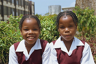 Portrait of two schoolgirls in school uniform, St. John, Barbados, West Indies, Caribbean, Central America