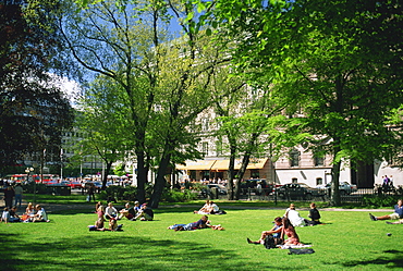 Groups of people in Berzelii Park in the city centre of Stockholm, Sweden, Scandinavia, Europe