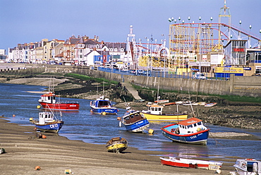 Amusement park and boats in mouth of River Clwyd, Rhyl town, Clywd, Wales, United Kingdom, Europe