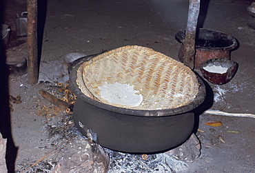 Manioc cooking over fire, Xingu area, Brazil, South America