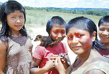 Gorotire Indian girls with coati, Brazil, South America