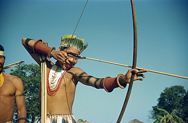 Portrait of a Karaja Indian boy with bow and arrow at Bananal, Brazil, South America