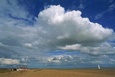 White clouds in a blue sky at Shingle Street near Felixstowe, Suffolk, England, United Kingdom, Europe