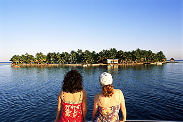 Girls looking at view, Tobacco Cay, Belize, Central America