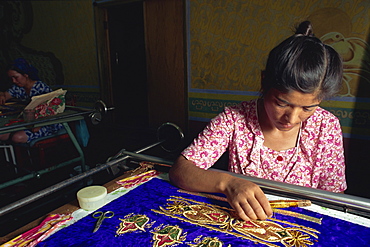 Worker in embroidery factory, Bukhara, Uzbekistan, Central Asia, Asia