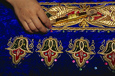 Detail of gold embroidery work in embroidery factory, Bukhara, Uzbekistan, Central Asia, Asia