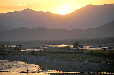 Crossing river at dusk, near Mingora, Swat Valley, Pakistan, Asia