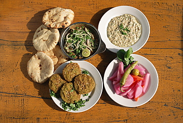 Plates of traditional food, falafel, babaghanoush and shawarma, with flat bread, Cairo, Egypt, North Africa, Africa