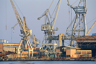 Cranes and wharves at entrance to the Suez Canal, Port Said, Egypt, North Africa, Africa