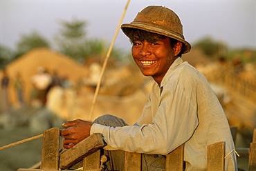 Portrait of a bullock cart driver at a government rice depot, near Bago (Pegu), Myanmar (Burma), Asia