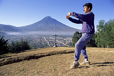 T'ai chi exercises at dawn, Agua volcano, Antigua, Guatemala, Central America