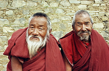 Portrait of two elderly Buddhist monks, Ganden monastery, Tibet, China, Asia