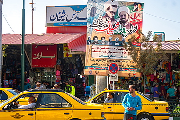 Street scene with religious poster, Qom, Iran, Middle East