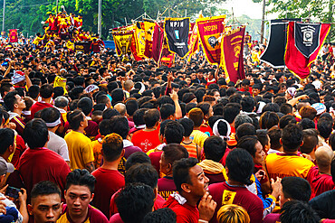 Flag carriers lead final procession of the Black Cross and Jesus at annual Feast of the Black Nazarene across Manila, Philippines, Southeast Asia, Asia