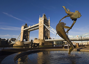 Tower Bridge and the Girl with a Dolphin sculpture, River Thames, London, England