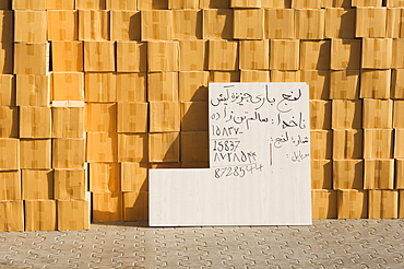 Goods stacked on the dockside of the Dhow Wharfage awaiting transportation by dhow to ports throughout the Middle East, India and Asia, Dubai Creek, Dubai, United Arab Emirates, Middle East