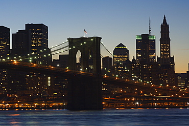 Manhattan skyline and Brooklyn Bridge at dusk, New York City, New York, United States of America, North America