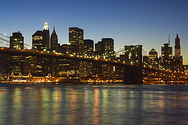 Manhattan skyline and Brooklyn Bridge at dusk, New York City, New York, United States of America, North America