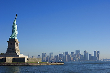 Statue of Liberty, Liberty Island and Manhattan skyline beyond, New York City, New York, United States of America, North America