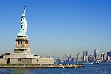 Statue of Liberty, Liberty Island and Manhattan skyline beyond, New York City, New York, United States of America, North America