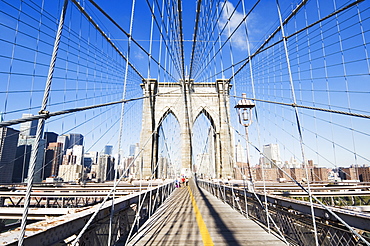 Pedestrian walkway on the Brooklyn Bridge looking towards Manhattan, New York City, New York, United States of America, North America