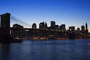 Manhattan skyline and Brooklyn Bridge at dusk, New York City, New York, United States of America, North America