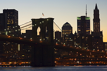 Manhattan skyline and Brooklyn Bridge at dusk, New York City, New York, United States of America, North America