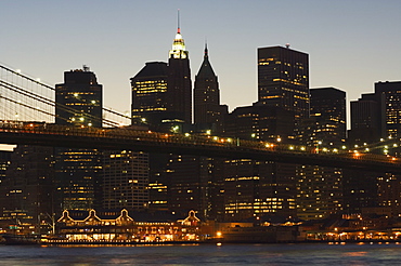 Manhattan skyline and Brooklyn Bridge at dusk, New York City, New York, United States of America, North America