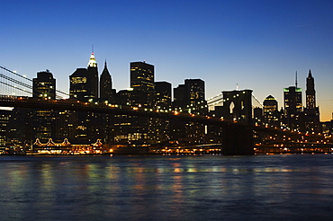 Manhattan skyline and Brooklyn Bridge at dusk, New York City, New York, United States of America, North America