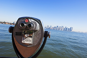 Coin operated binoculars facing Manhattan skyline, Liberty Island, New York City, New York, United States of America, North America