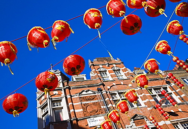 Lisle Street, Chinatown, during the Chinese New Year celebrations, decorated with colourful Chinese lanterns, Soho, London, England, United Kingdom, Europe