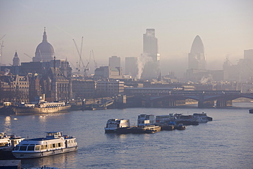 Early morning fog over the City of London skyline, London, England, United Kingdom, Europe