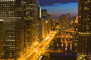 Buildings along Wacker Drive and the Chicago River at dusk, Chicago, Illinois, United States of America, North America