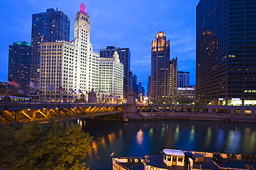 The Wrigley Building, North Michigan Avenue, and Chicago River at dusk, Chicago, Illinois, United States of America, North America