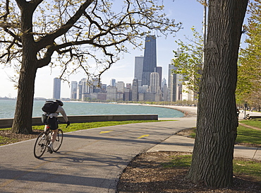 Cyclist by Lake Michigan shore, Gold Coast district, Chicago, Illinois, United States of America, North America