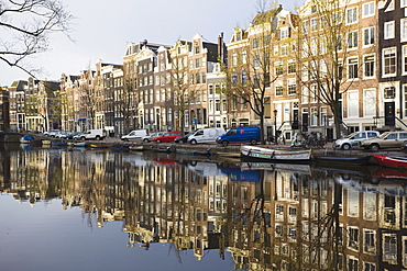 Houses reflecting in the Singel canal, Amsterdam, Netherlands, Europe