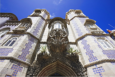 Fierce gargoyle above archway, Pena National Palace, UNESCO World Heritage Site, Sintra, Portugal, Europe