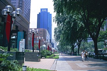 Tree lined avenue of shops and malls, Orchard Road, Singapore, Asia