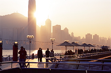 Avenue of Stars, Tsim Sha Tsui, Kowloon, with Victoria Harbour and skyline of Hong Kong Island in the background at dusk, Hong Kong, China, Asia