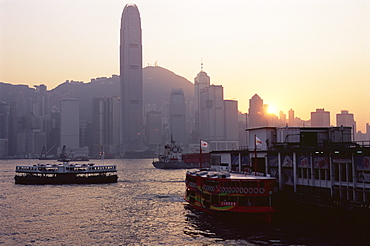 Star Ferry, Victoria Harbour and skyline of Hong Kong Island at sunset, Hong Kong, China, Asia