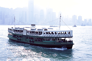 Star Ferry, Victoria Harbour, with Hong Kong Island skyline in mist beyond, Hong Kong, China, Asia