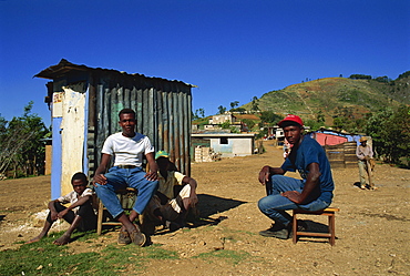 Four young men, Borlotte shack at village of Godet, Haiti, West Indies, Central America